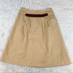 Mayle pleated leather embellished a-line skirt in tan